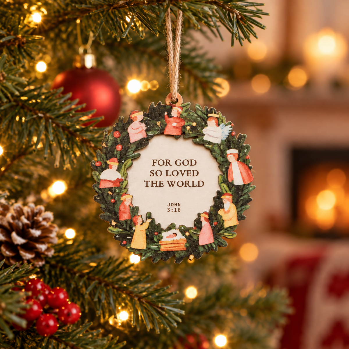For God So Loved the World John 3:16 Christmas tree bauble hanging on a warmly lit festive tree