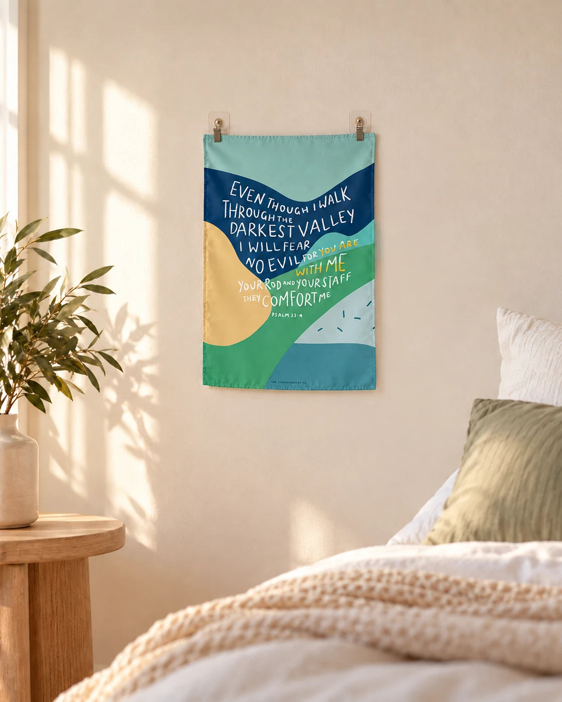 For You Are With Me Psalm 23:4 small wall tapestry hanging above a cosy bed in a sunlit bedroom