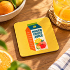 Fruit Juice of the Spirit Love Supermarket Christian coaster styled with fresh citrus fruit and orange juice on a wooden table.