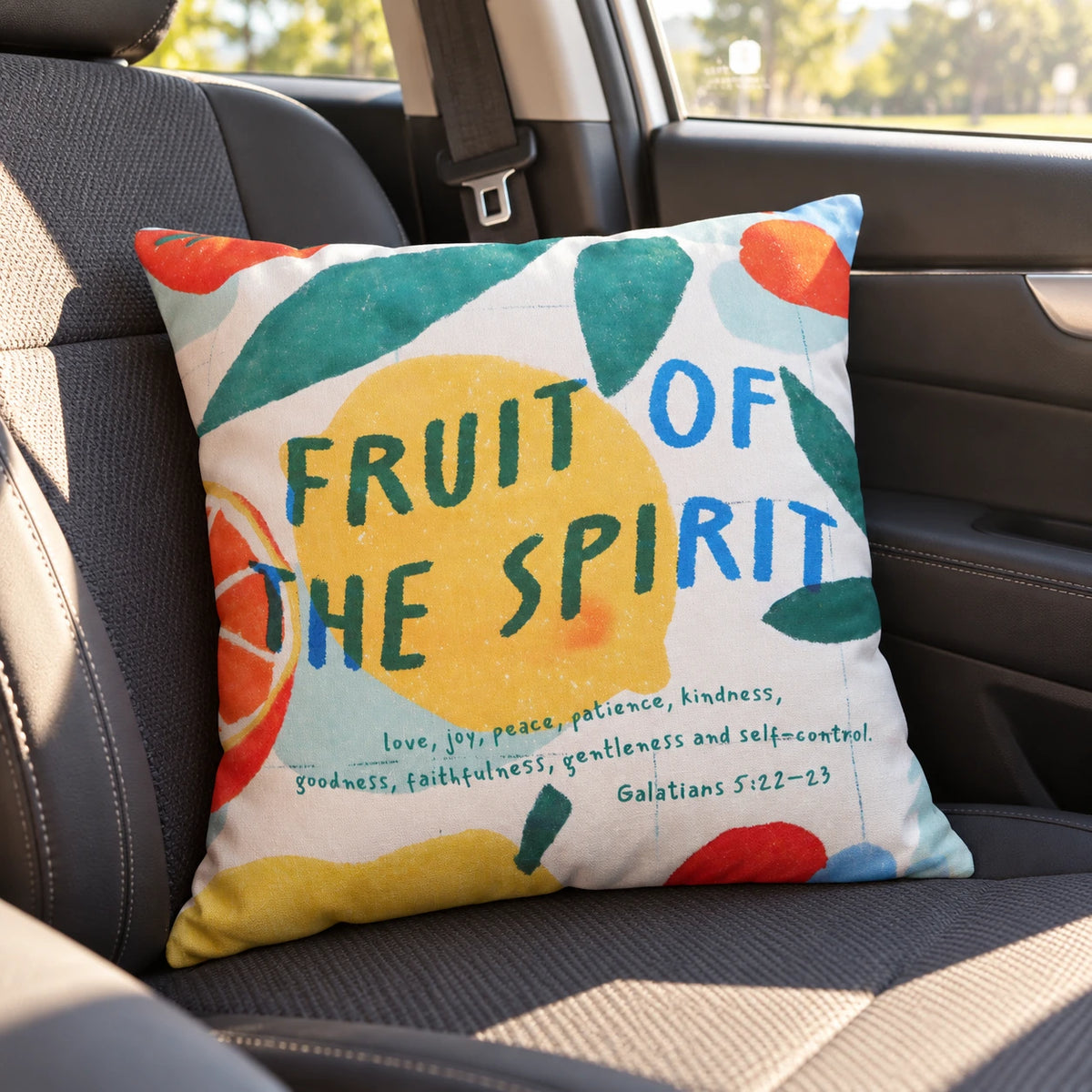 Fruit of the Spirit Galatians 5:22–23 Christian cushion cover resting on the seat of a car