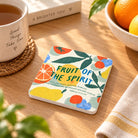 Fruit of the Spirit Galatians 5:22–23 Christian coaster styled with fruit in a bright home setting