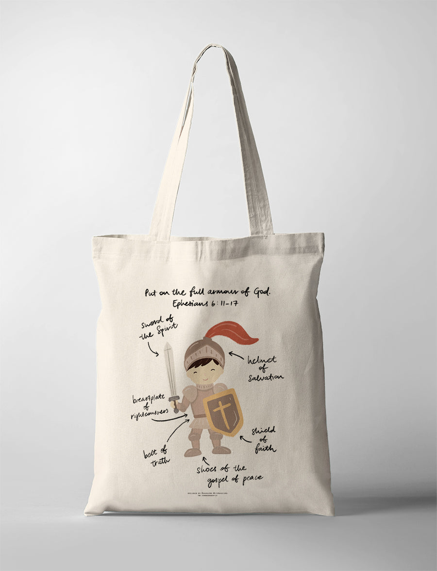 Christian kids tote bag featuring a boy in the full armour of God with labelled pieces from Ephesians 6:11–17, including the sword of the Spirit, helmet of salvation, shield of faith, belt of truth, breastplate of righteousness, and shoes of the gospel of peace.
