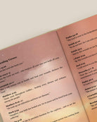 Open pages from Fully Restored by Project Made New featuring Bible verses about healing on a soft pink illustrated background