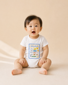 Baby wearing the Checklist Christian romper with colourful faith-based design