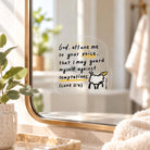 God Attune Me to Your Voice transparent Christian mirror decal sticker displayed on a gold-framed mirror in a sunlit room.