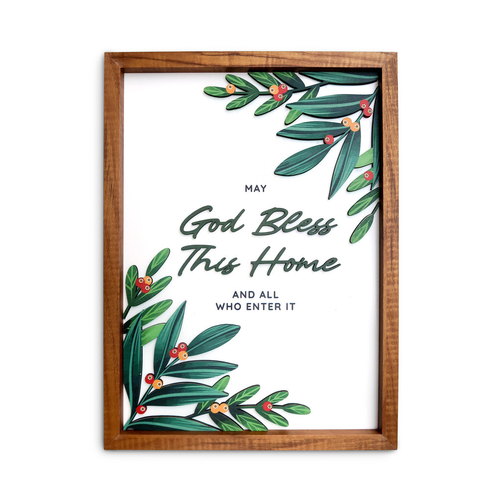 A wooden-framed wall art featuring the message "May God bless this home and all who enter it," adorned with green leaves and red berries, perfect for faith-inspired home decor or a housewarming gift.