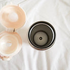 Interior view of the God Is a Good Father thermal bottle showing its smooth stainless steel inner lining