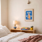 Blue God Is Within You Christian poster displayed in a warm neutral bedroom