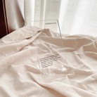 Acrylic phone stand printed with 'God Loves You' and Philippians 4:6-7 Bible verse