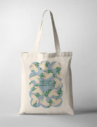 A canvas tote bag with a nature-inspired design featuring a intricate pattern of green leaves and doves, creating an artistic look. This design echoes the themes often found in faith-based posters, reflecting harmony and peace
