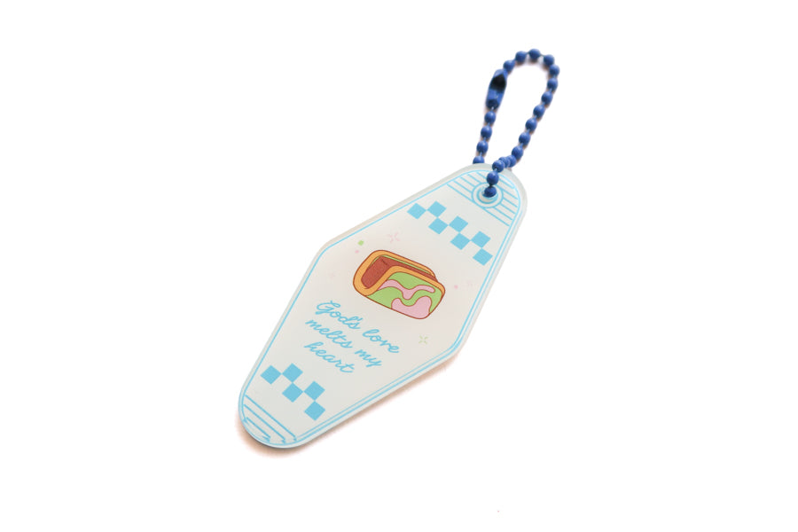 Angled view of Singapore-inspired traditional ice cream bread acrylic keychain with “God’s love melts my heart” design