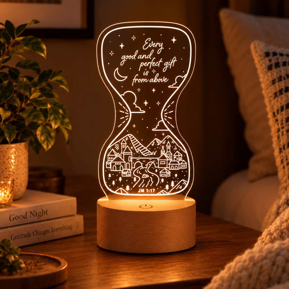 Good and Perfect Gift Christian night light glowing on a cosy bedside table