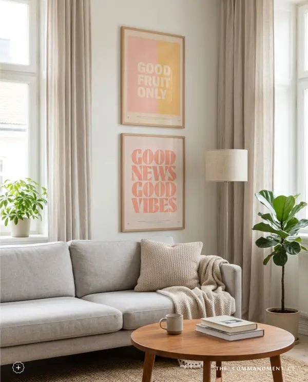 Good Fruit Only and Good News Good Vibes posters in a neutral living room