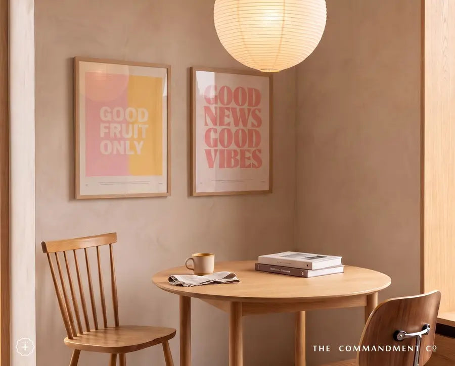 Good Fruit Only and Good News Good Vibes Christian posters in a warm dining room
