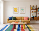 Goodness Is Coming Christian poster paired with Good Things Grow Slowly above a mustard sofa