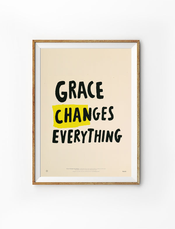 Grace Changes Everything Christian poster in a light wood frame