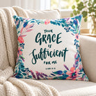 Your Grace Is Sufficient for Me floral Christian cushion cover with 2 Corinthians 12:9 displayed on a cream sofa.