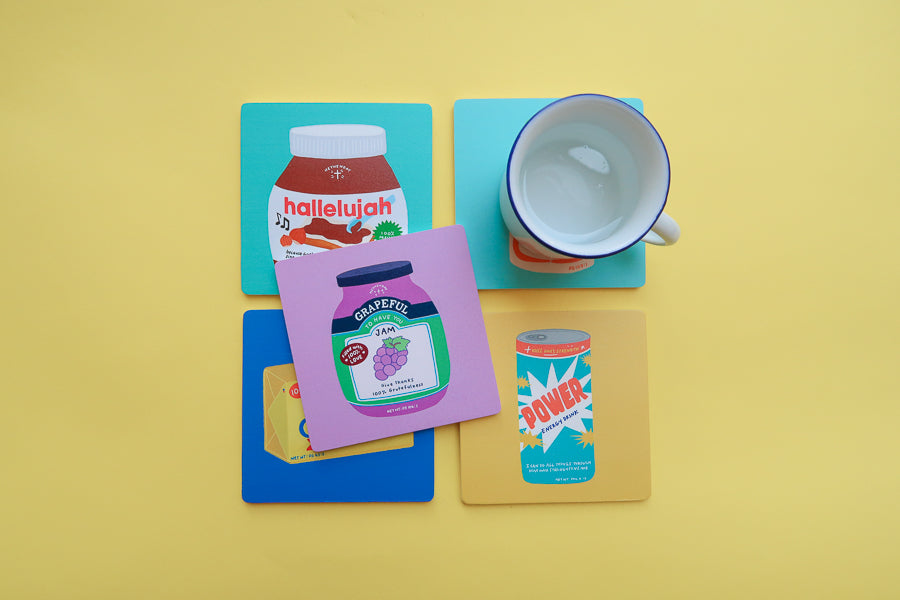 Grocery-inspired Christian coaster collection featuring playful faith messages.