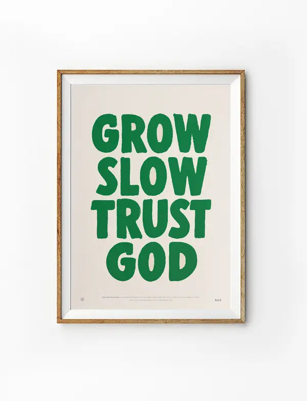 Grow Slow Trust God Christian poster in a light wood frame