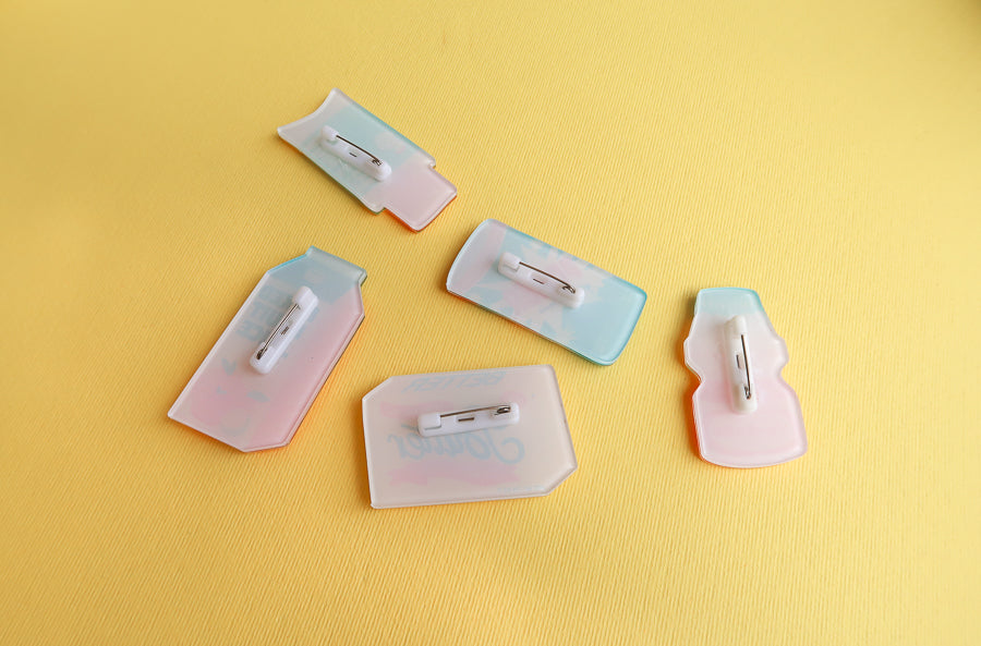 Back view of Hallelujah Chocolate Spread acrylic pin with pin fastening.
