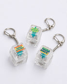 Hallelujah, Super Blessed and Amen Amen light-up keycap keychains arranged on a white background