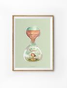 Christian wall art poster featuring an hourglass illustration with a girl surrounded by flowers and the quote “He has made everything beautiful in its time,” inspired by Ecclesiastes 3:11 (NLT). Encouraging Bible-themed artwork for home decor.
