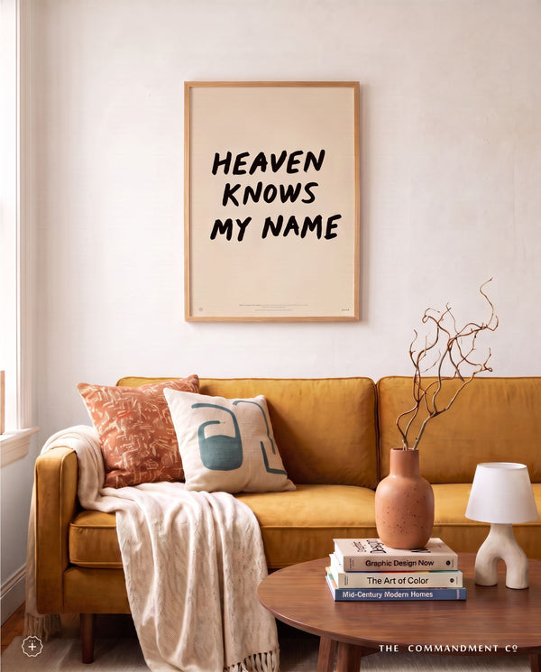 Heaven Knows My Name Christian poster styled above a warm living room sofa