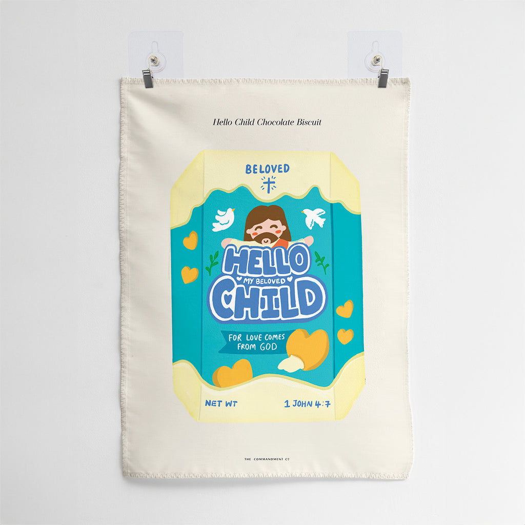 Wall tapestry featuring Hello Child design with chocolate biscuit illustration and scripture reference 1 John 4:7, emphasizing love from God.