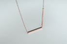 Hidden Message bar pendant necklace shown as a personalised gift.