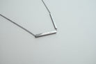 Personalised Hidden Message bar necklace lifestyle view.