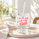 I Am So Loved glass tumbler with straw on cream tray in warm natural light