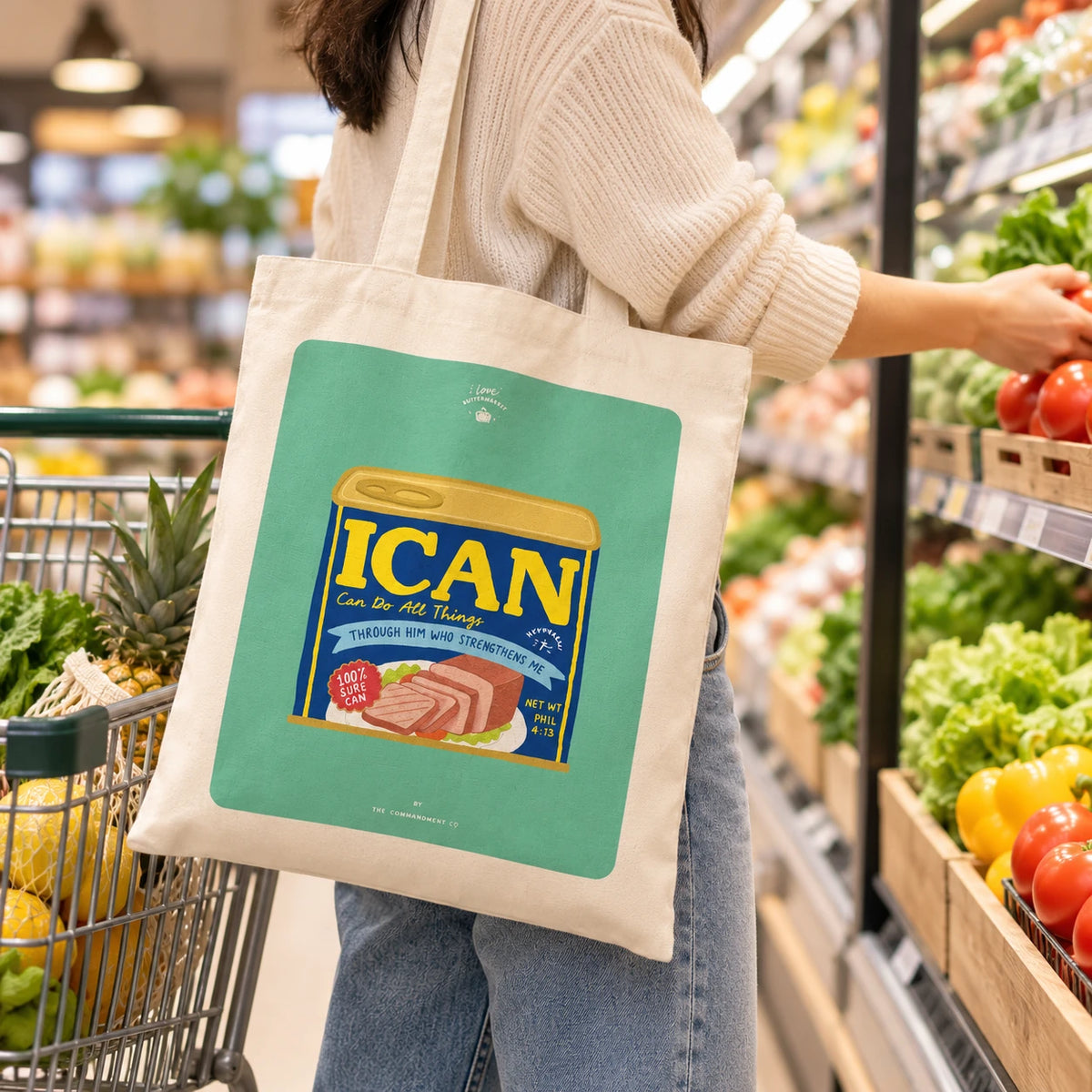 I Can Luncheon Meat Christian tote bag carried while shopping for fresh produce in a supermarket
