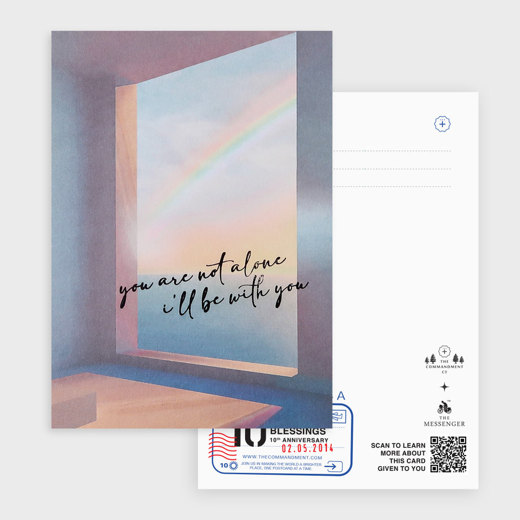 A postcard featuring a serene view of a rainbow through a window and the comforting message "You are not alone, I'll be with you," designed to inspire hope and support.