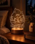 I Will Be With You Isaiah 43:2 campfire Christian night light glowing on a cosy bedside table at night