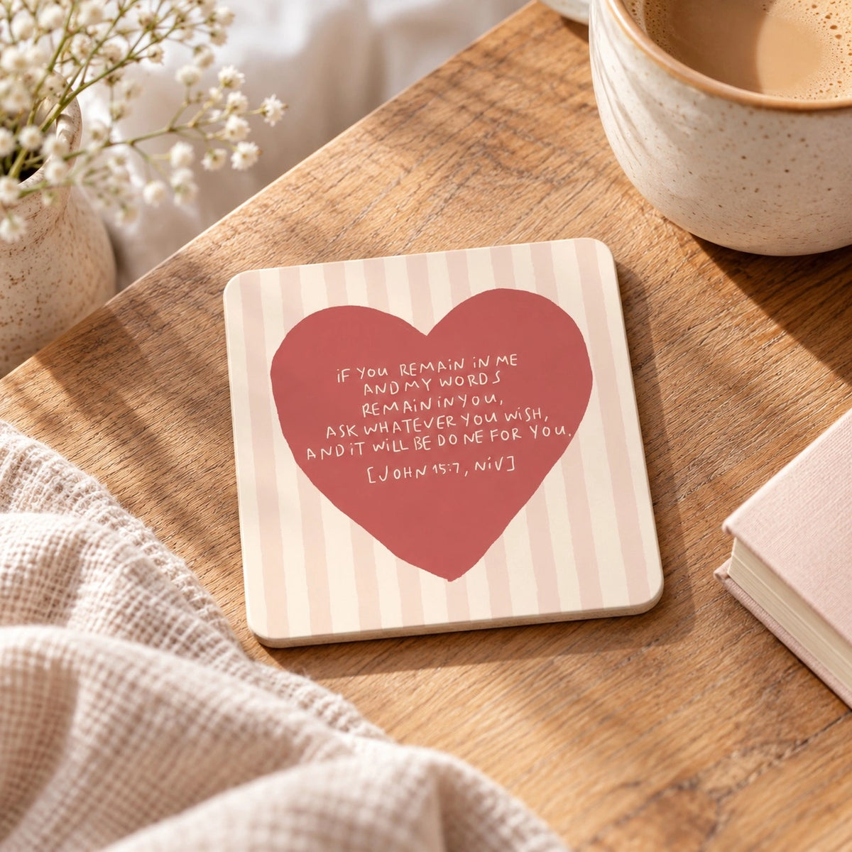 If You Remain in Me Christian coaster with John 15:7 heart design styled on a warm wooden table.