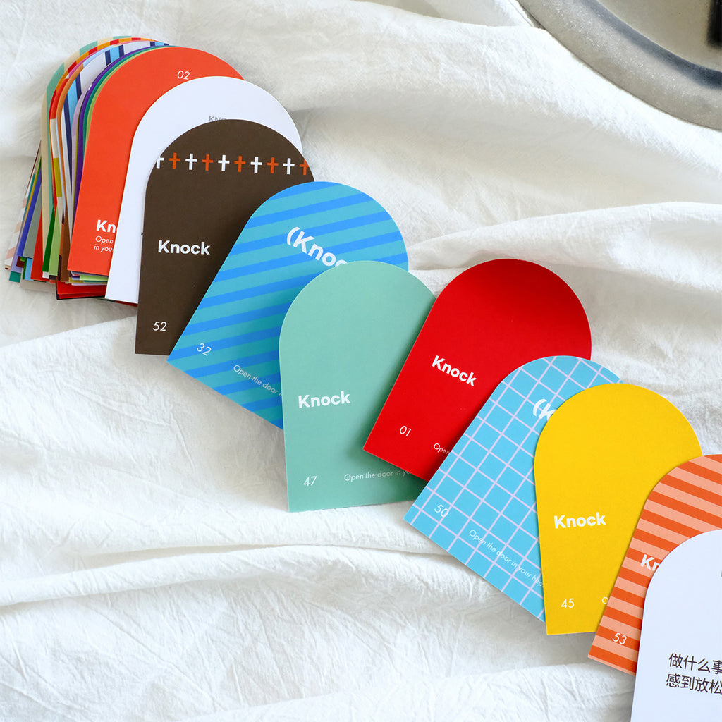 Colorful Knock conversation card set designed for inspiring meaningful talks and dialogue, featuring the message 'Open the door to your heart'.