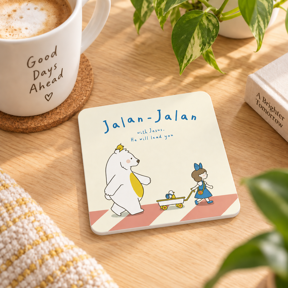 Jalan-Jalan with Jesus Christian coaster on a sunlit wooden table