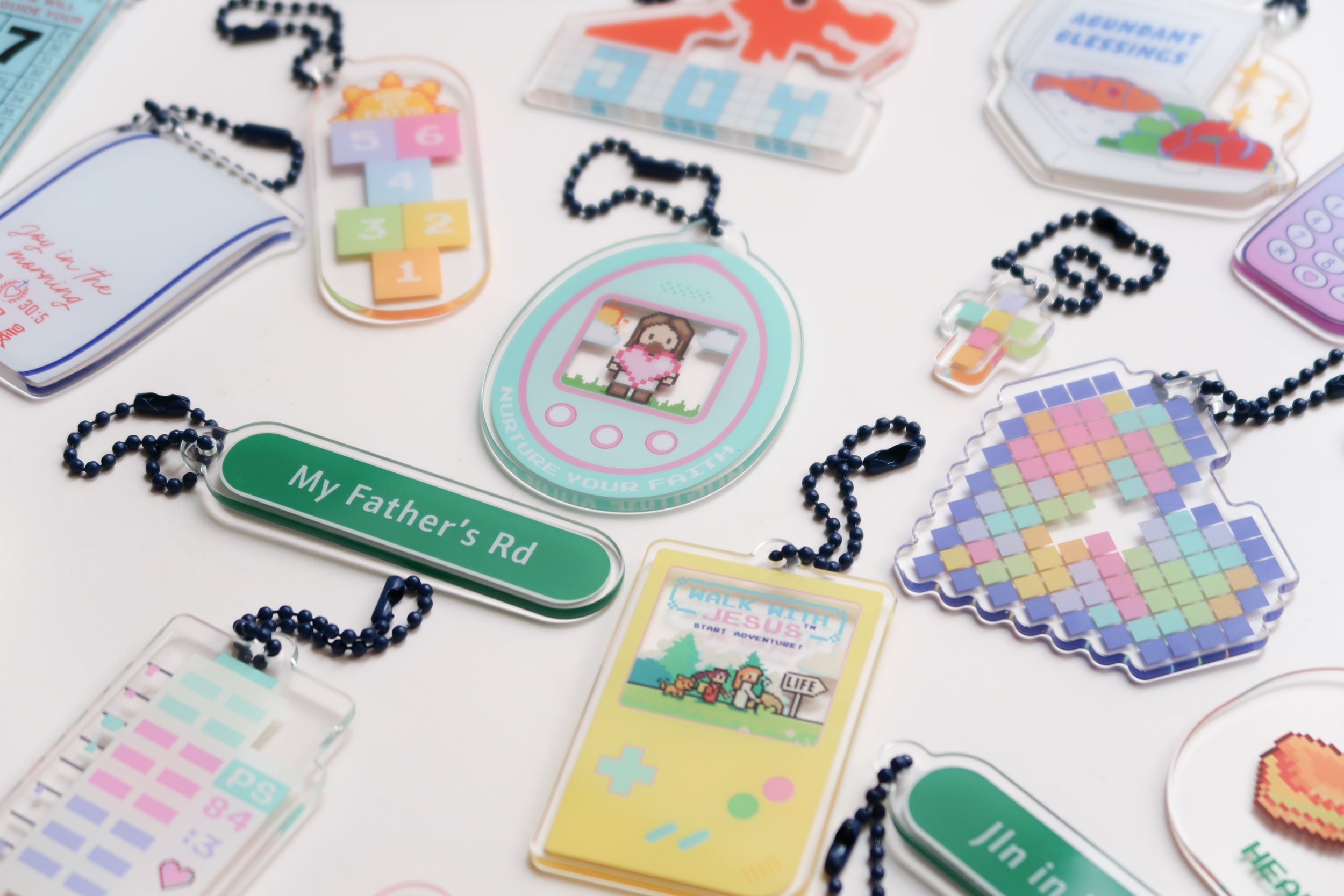 A cheerful assortment of Jesus children's day acrylic keychains featuring playful designs, uplifting Christian messages, and vibrant colors, perfect for inspiring simple happiness and faith in kids.