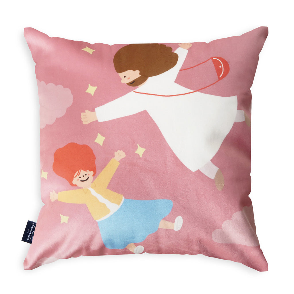 Decorative throw pillow featuring an illustration of Jesus and a child flying through the sky with a pink cloud background, perfect for Christian faith-based home decor.