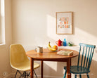 Jesus Is My Plus One poster styled above a colourful dining area