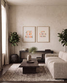 Jesus Is My Plus One poster displayed with Joy Lives Here wall art in a living room