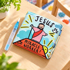 Jesus Miracle Worker reusable water-reveal bath book with refillable water brush on a bright children's table.