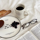 Jin Cha God Dear Father prayer ceramic mug in an overhead quiet-time setting with Bible and breakfast