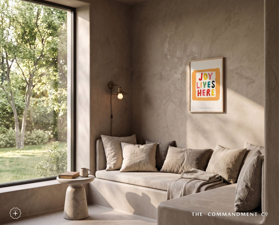 Joy Lives Here Christian wall art styled in a warm modern living room