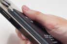 Close-up of premium full-grain leather texture and precise stitching on the Leather MagSafe Wallet