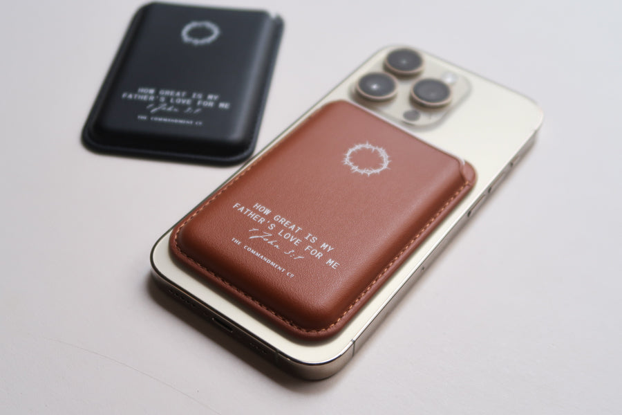 Lifestyle shot of brown Leather MagSafe Wallet attached to a smartphone, showcasing slim premium leather in everyday use