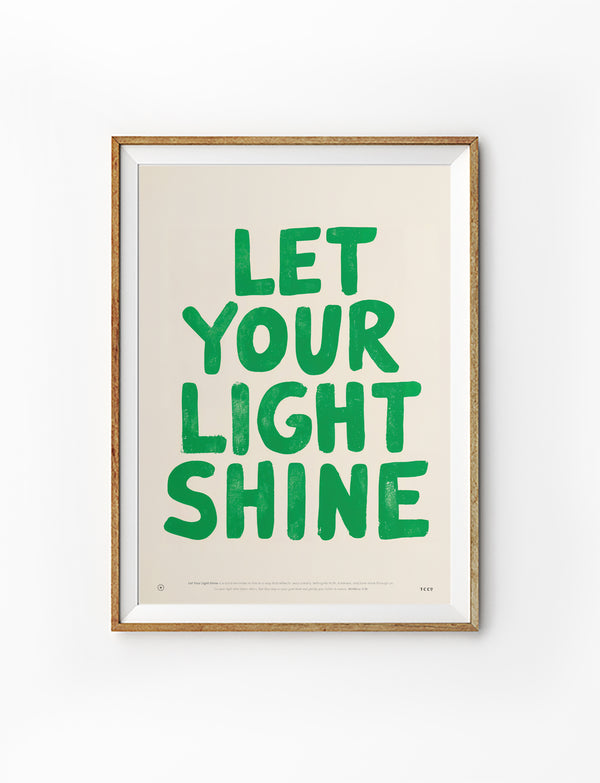Let Your Light Shine Christian poster with bold green lettering displayed in a wooden frame on a white background
