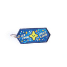 Embroidered keychain with 'Let Your Light Shine' and a smiling star.
