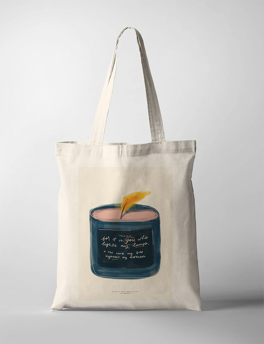 Christian tote bag featuring a candle illustration with Psalm 18:28, “You light my lamp”