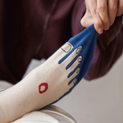 Close-up of Living in Christ Christian toe socks with blue and cream design, featuring a faith-inspired illustration by The Commandment Co